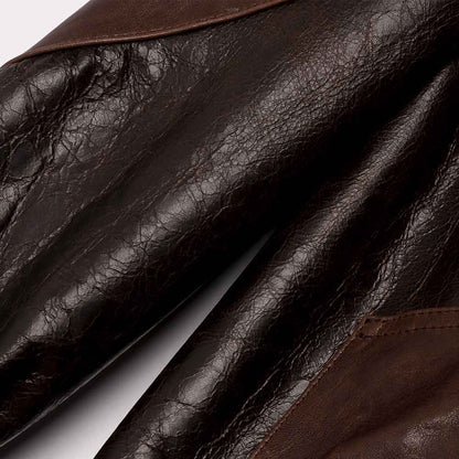 Close-up of brown leather gloves with a focus on texture and color.