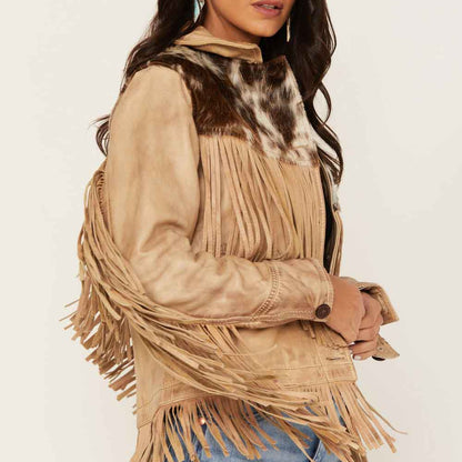 Beige fringed jacket worn by a person on a white background