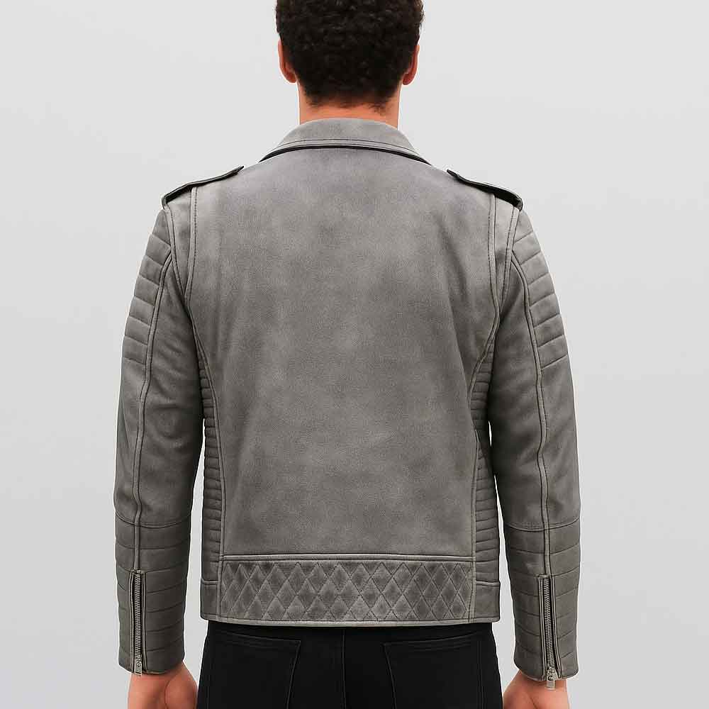 Person wearing a gray leather jacket on a plain background