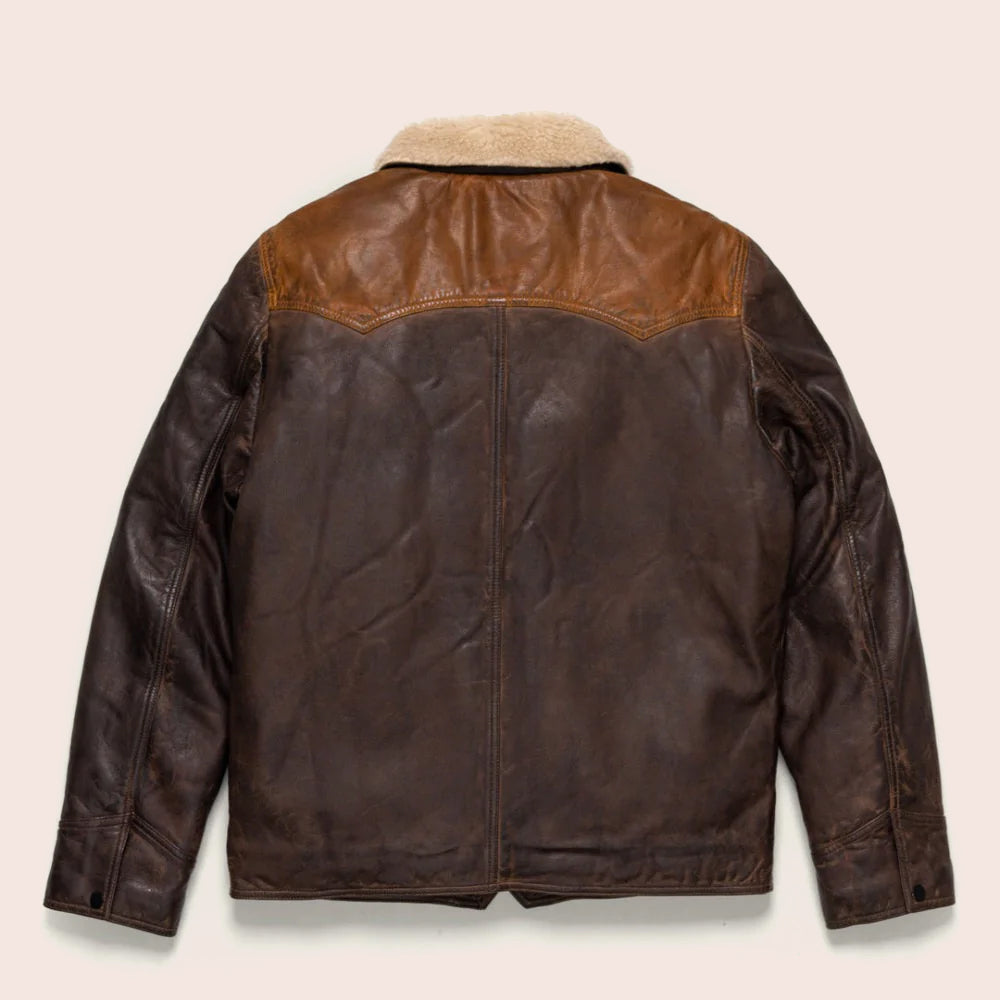 Brown leather jacket with fur lining on a beige background
