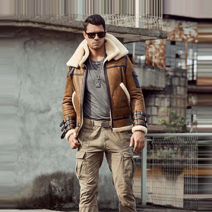 Man wearing a brown shearling jacket and sunglasses in an urban setting
