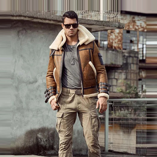 Man wearing a brown shearling jacket and sunglasses in an urban setting