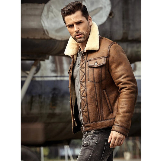 Man wearing a brown leather jacket with a white fur collar in an industrial setting