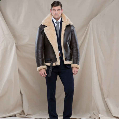 Man wearing a brown leather jacket with fur lining against a plain background