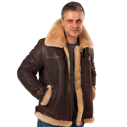 Man wearing a brown leather jacket with fur lining on a white background
