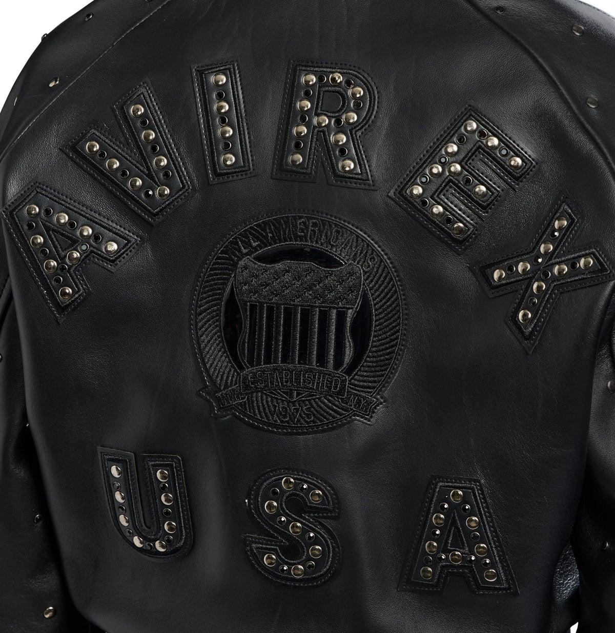 Close-up of black Avirex back appliqué, crest and metallic studs