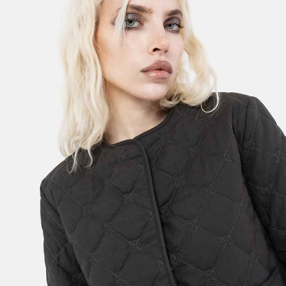 Close up of a Woman wearing black quilted jacket