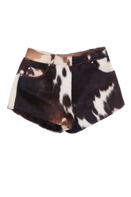Cow print shorts with a brown, black, and white pattern, featuring a waistband with belt loops and side pockets, shown against a plain white background.