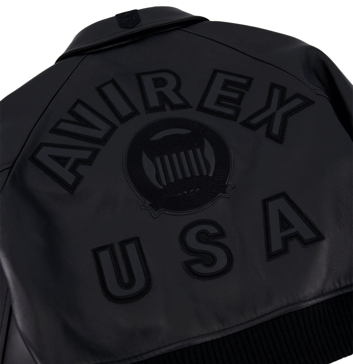 Angled welt pockets on women’s cropped black leather jacket
