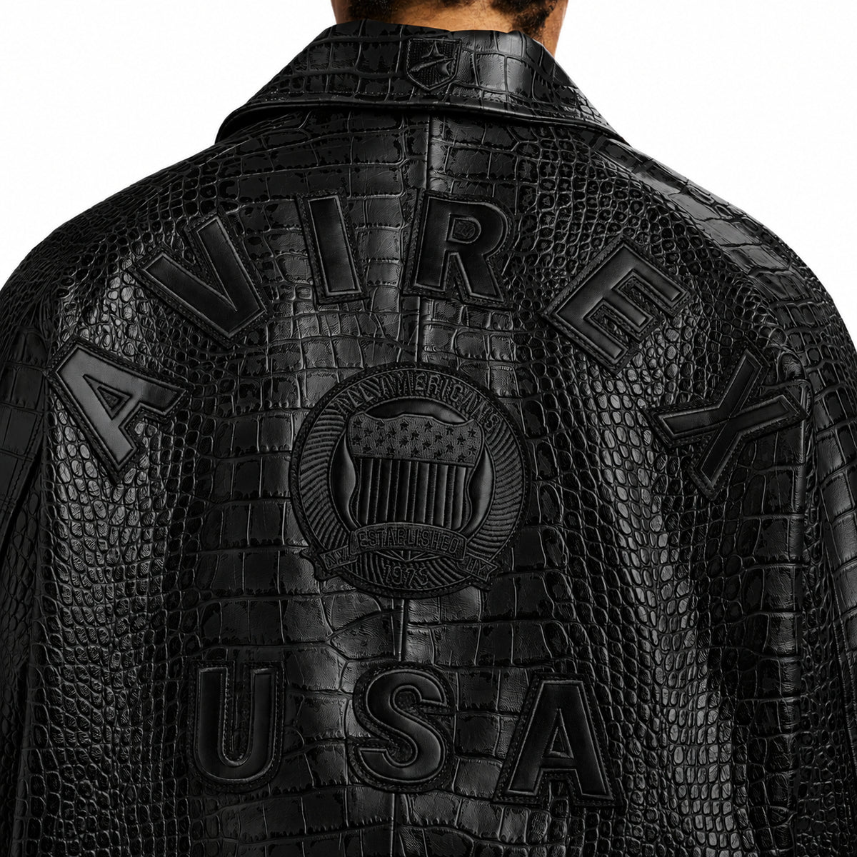 Close-up of tonal Avirex USA back logo on black goatskin