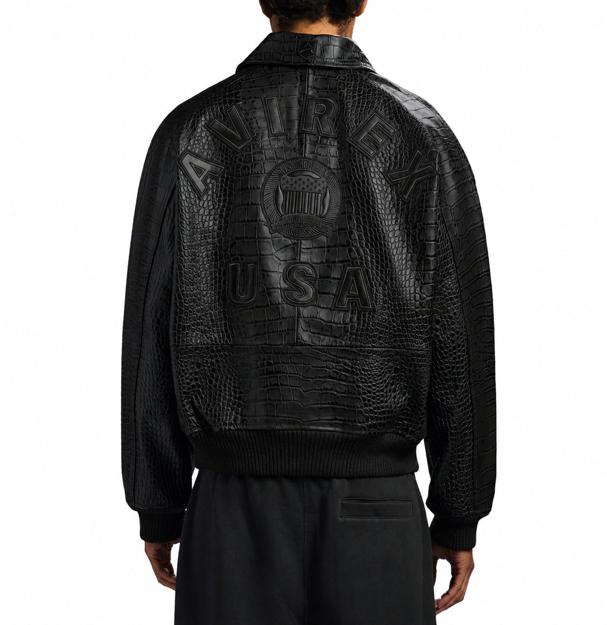Male model wearing black Avirex croc-effect leather jacket from the back