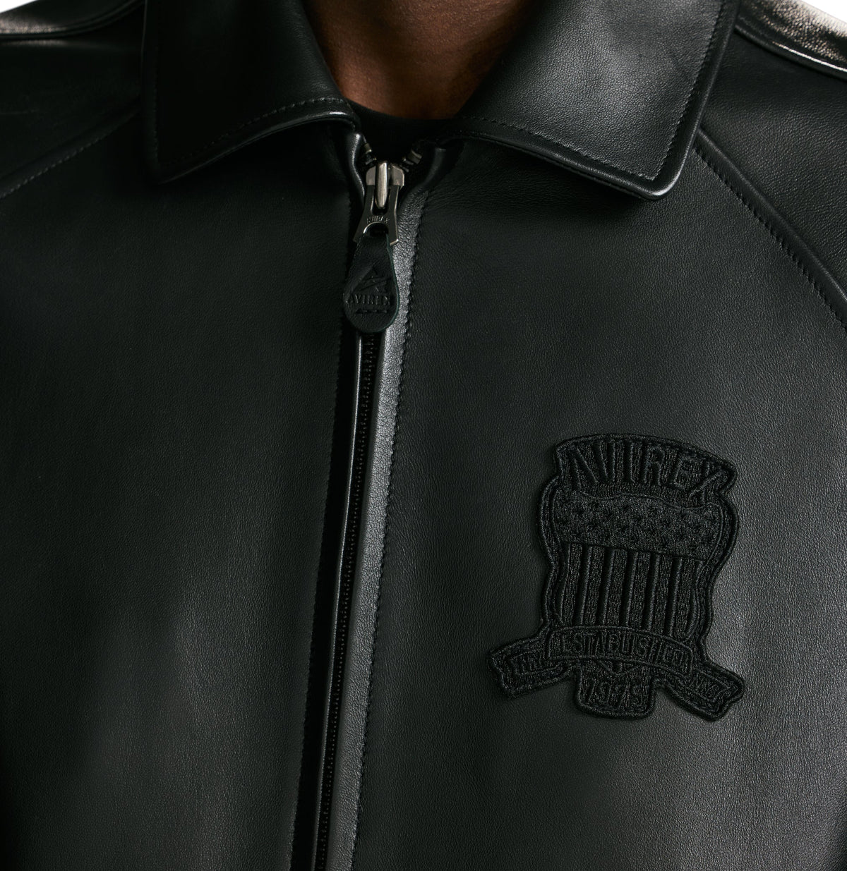 Full front styling of black Avirex lambskin bomber jacket