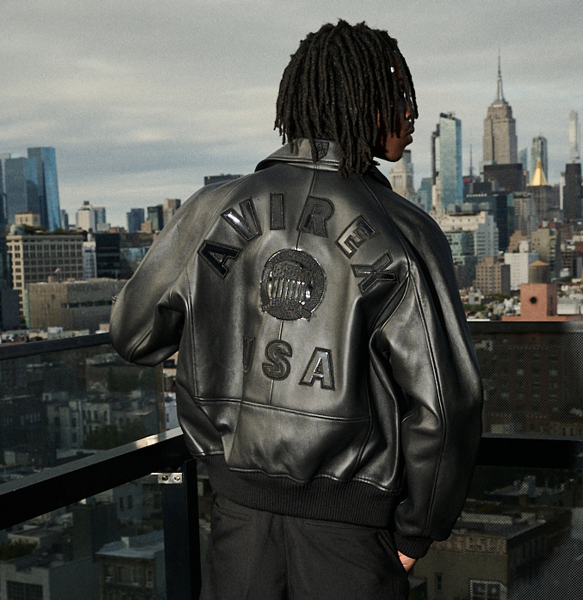 Relaxed black Avirex leather jacket worn with tonal clothing