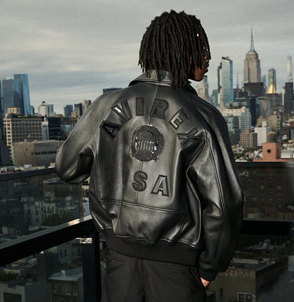 Relaxed black Avirex leather jacket worn with tonal clothing