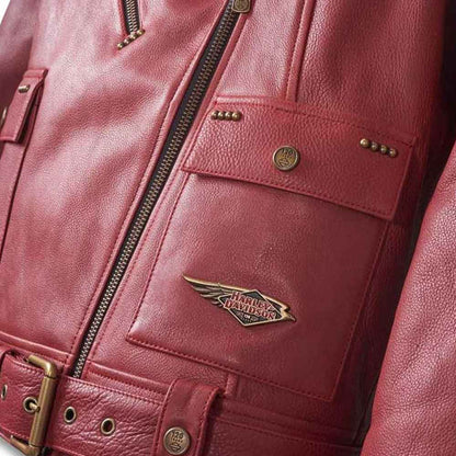 Close-up of a red leather jacket with a brand logo on a dark background