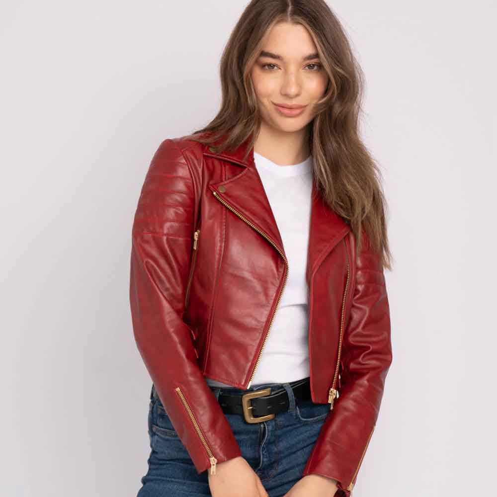 Woman wearing a red leather jacket on a white background