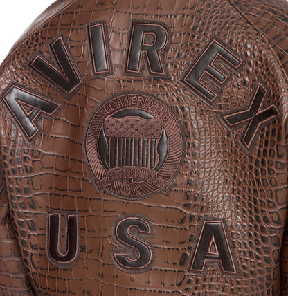 Close-up of tonal AVIREX leather lettering and embroidered back crest
