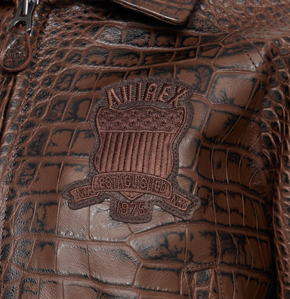 Tonal Avirex chest crest on brown crocodile-pattern leather
